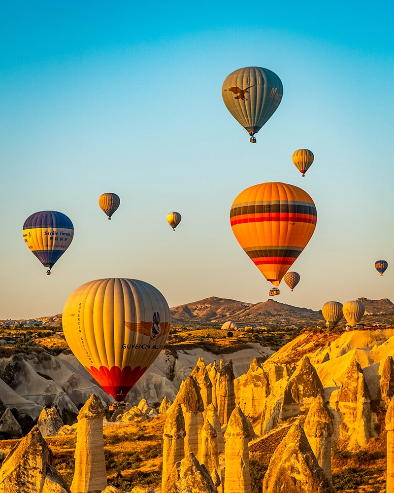 Hot air balloons at sunset in Goreme valley, Cappadocia, Turkey